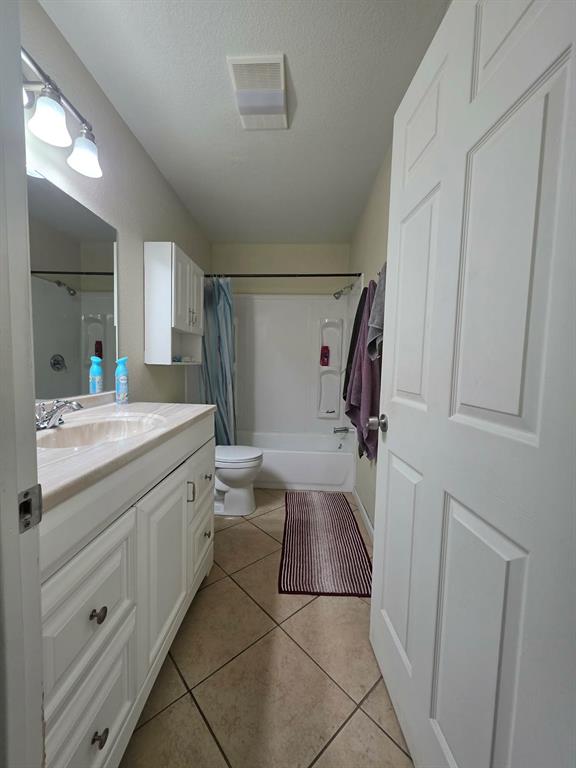 739 Bluebonnet Street Mexia, TX 76667 - Photo 18 of 28 a bathroom with a sink a toilet and mirror