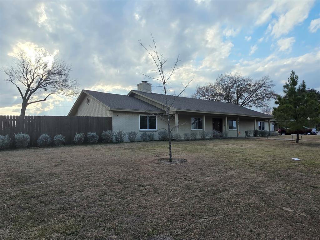 739 Bluebonnet Street Mexia, TX 76667 - Photo 2 of 28 a house view with a garden space