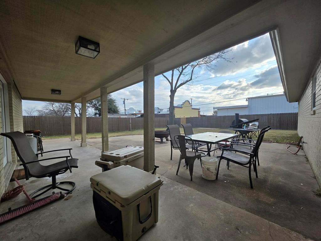 739 Bluebonnet Street Mexia, TX 76667 - Photo 21 of 28 a living room with furniture a rug and a large window