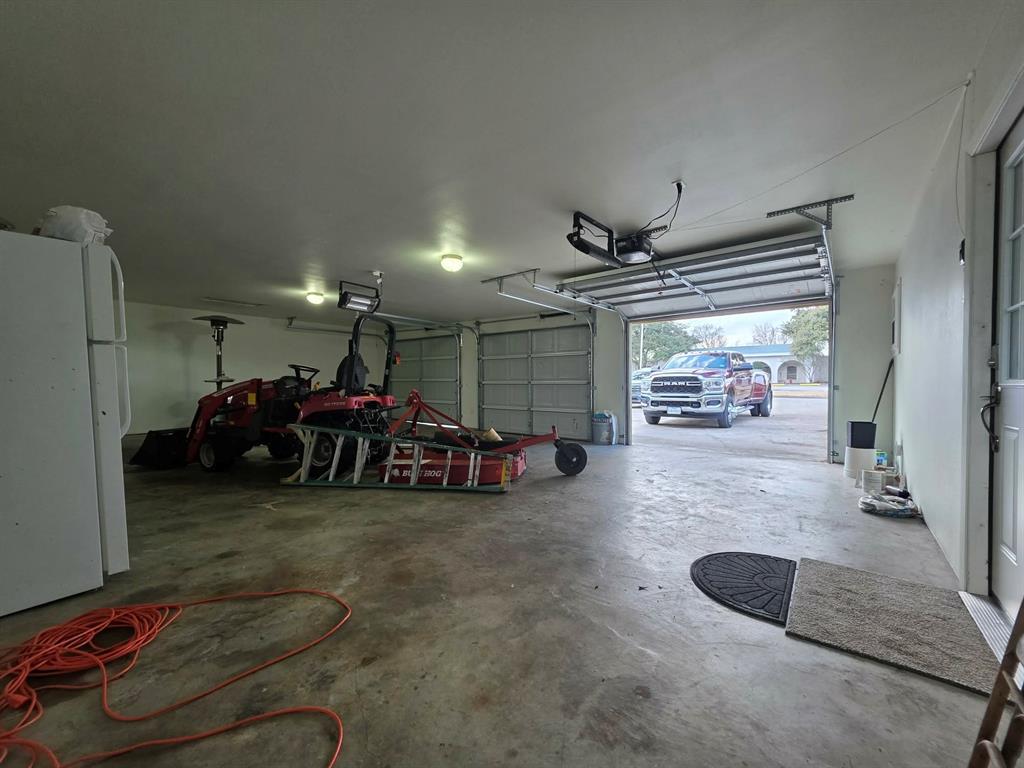 739 Bluebonnet Street Mexia, TX 76667 - Photo 24 of 28 a view of a garage with parked cars