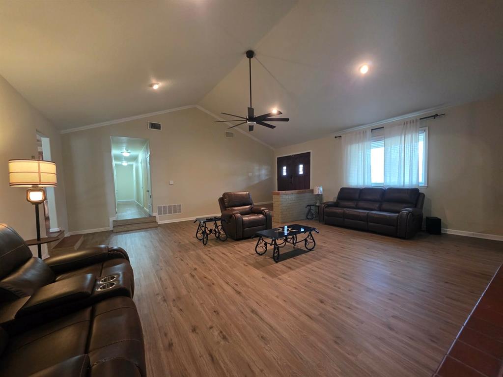 739 Bluebonnet Street Mexia, TX 76667 - Photo 5 of 28 a living room with furniture and a wooden floor
