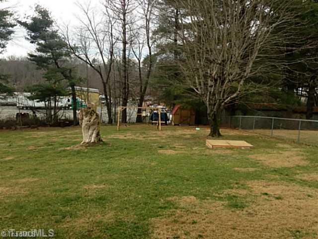 204 Ridgeview Drive Mount Airy, NC 27030 - Photo 15 of 16 Exterior Back. Nice fenced in back yard with fire pit for entertaining. Storage building to remain and child s swing set