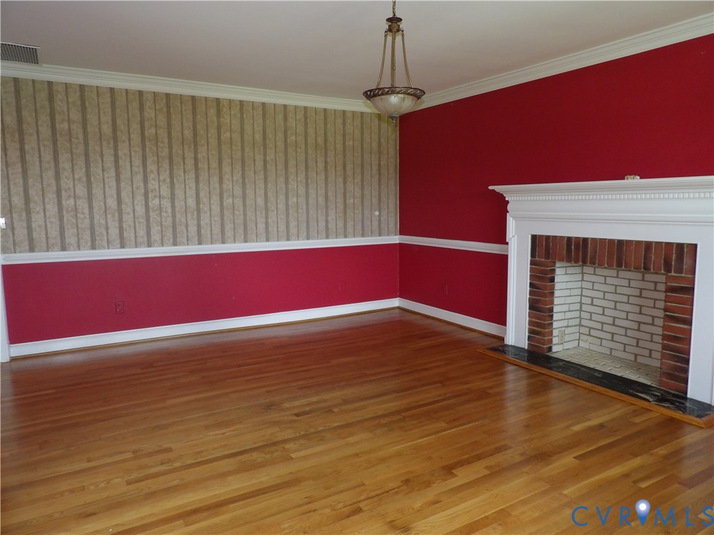 3813 Johnson Road Petersburg, VA 23805 - Photo 20 of 51 Hardwood flooring, brick fireplace with a white ma