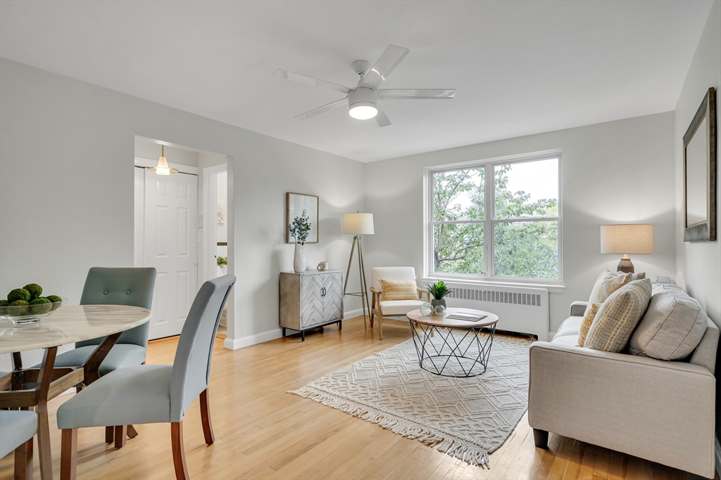 136 Beaconsfield Road, Unit 6 Brookline, MA 02445 - Photo 1 of 17 a living room with furniture and a large window