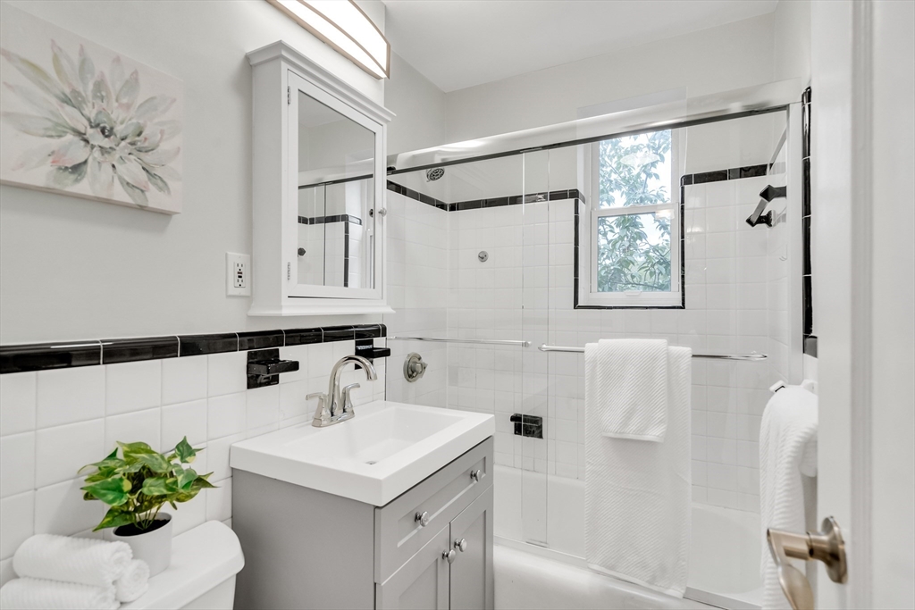 136 Beaconsfield Road, Unit 6 Brookline, MA 02445 - Photo 12 of 17 a bathroom with a sink toilet and shower