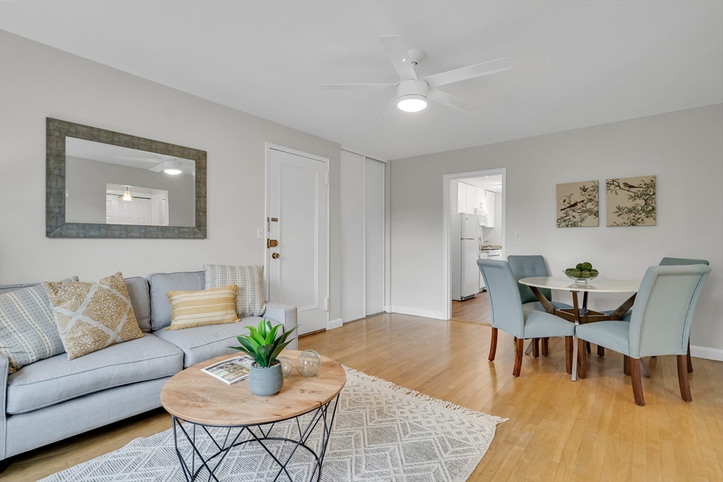 136 Beaconsfield Road, Unit 6 Brookline, MA 02445 - Photo 3 of 17 a living room with furniture and wooden floor
