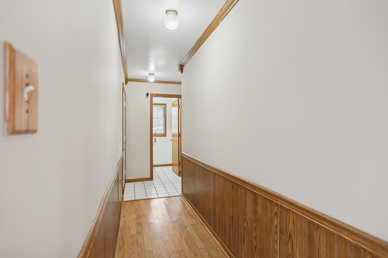 11030 South Roberts Road, Unit 1 Palos Hills, IL 60465 - Photo 3 of 16 a view of a hallway with wooden floor