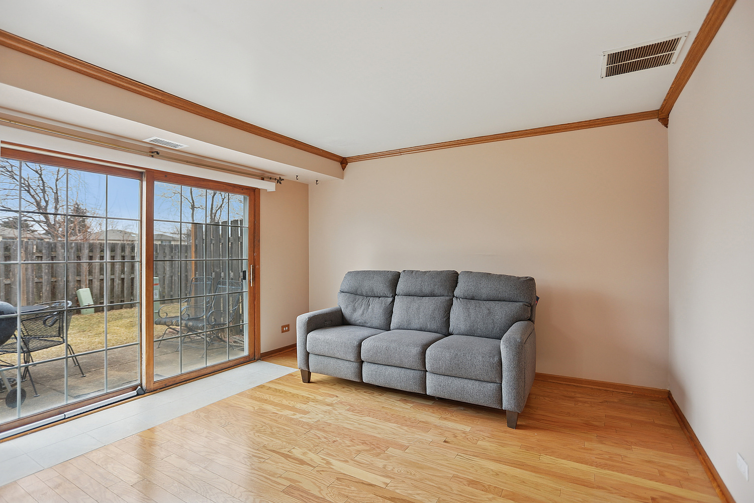 11030 South Roberts Road, Unit 1 Palos Hills, IL 60465 - Photo 4 of 16 a living room with furniture and a floor to ceiling window
