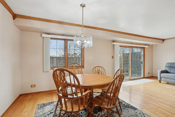 a view of a dining room with furniture window and outside view