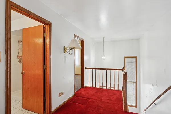 a view of a hallway with entryway doors