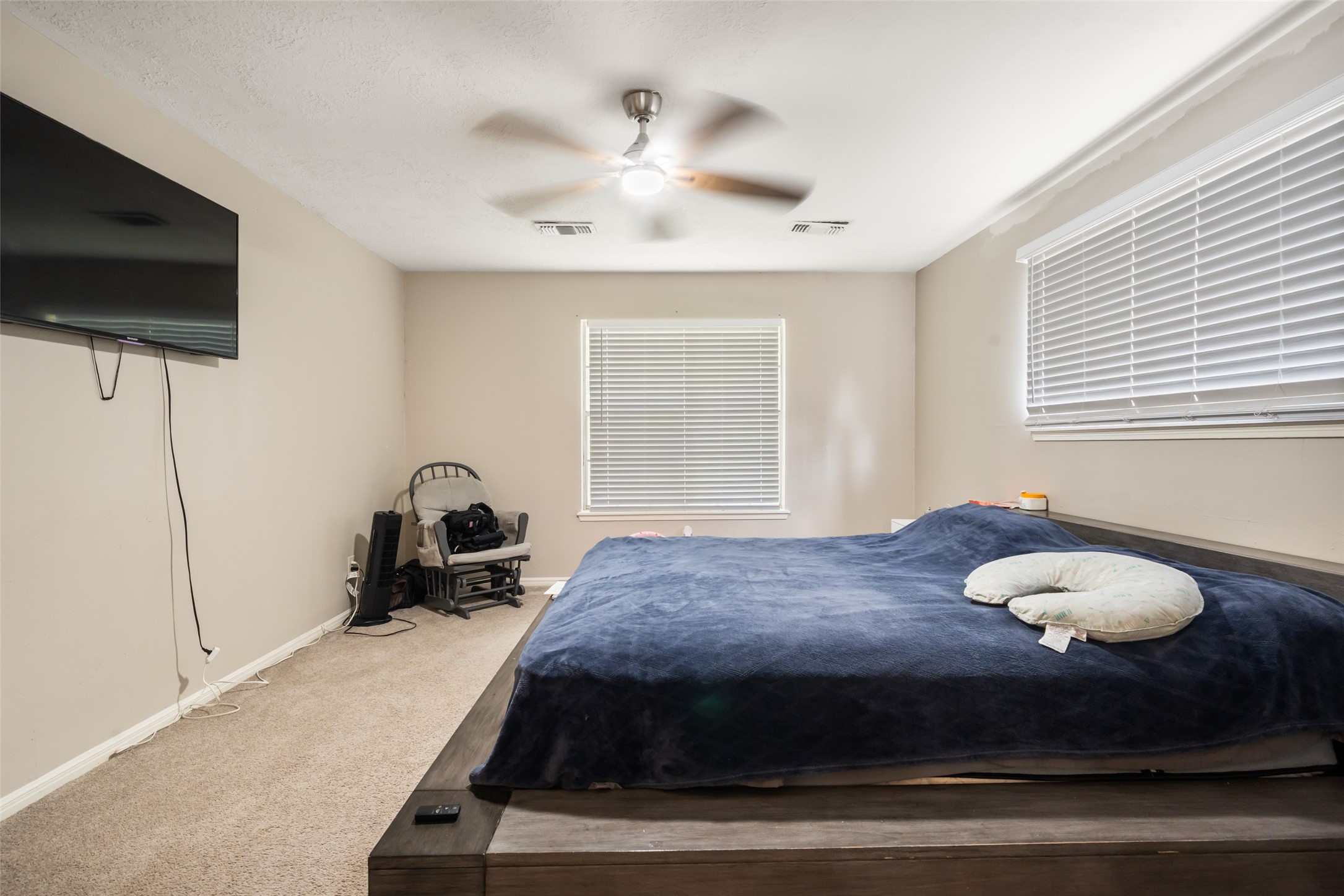 715 Marne Lane Houston, TX 77090 - Photo 12 of 25 a living room with furniture and a flat screen tv