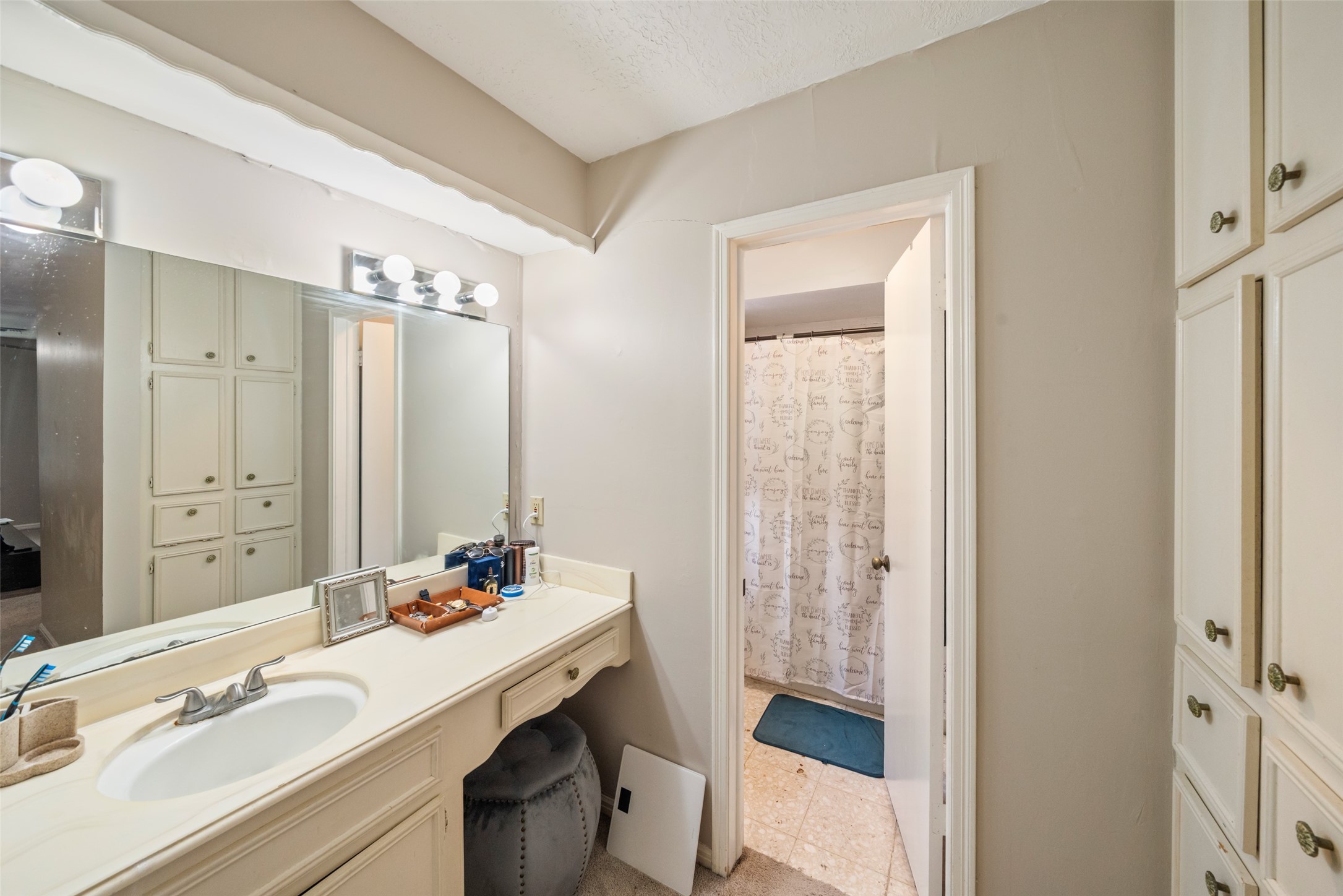 715 Marne Lane Houston, TX 77090 - Photo 17 of 25 a bathroom with a granite countertop sink toilet and shower