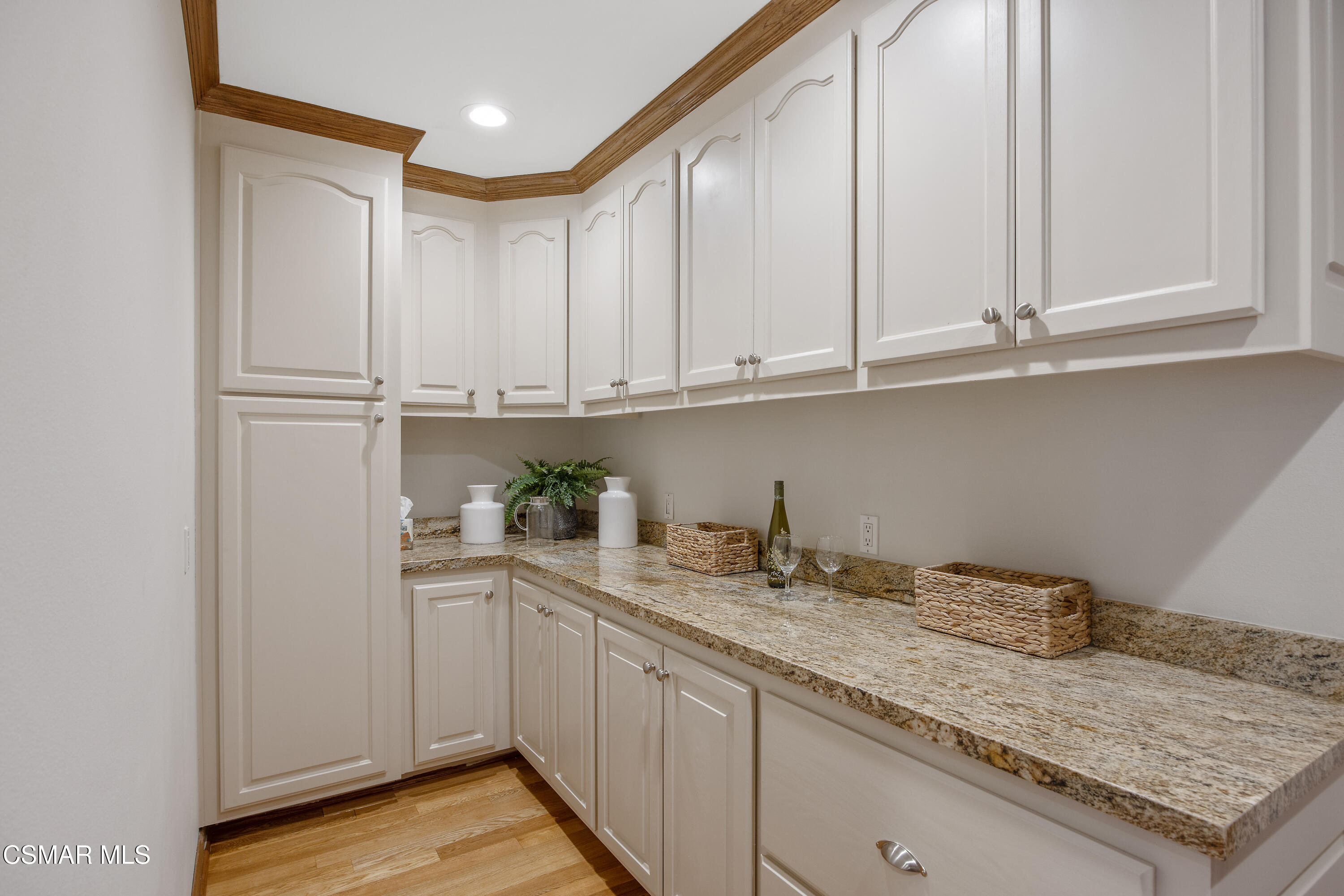 3840 Castle View Road Agoura Hills, CA 91301 - Photo 23 of 94 a kitchen with stainless steel appliances granite countertop a sink and cabinets with wooden floor