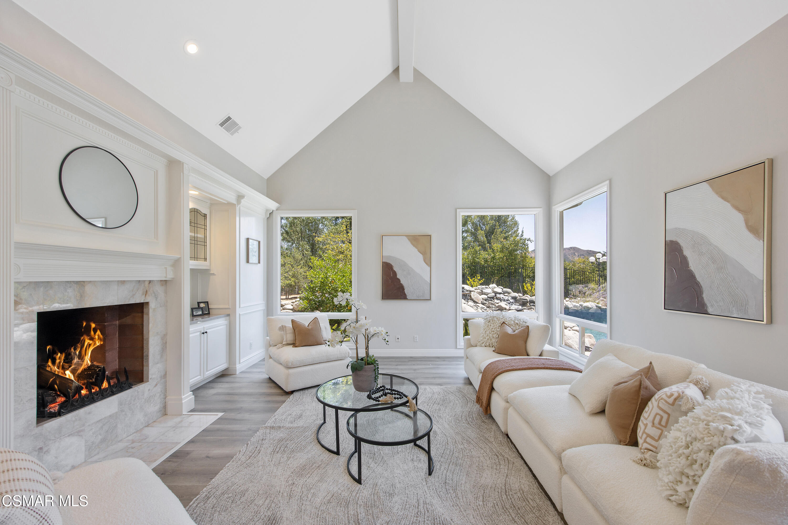 3840 Castle View Road Agoura Hills, CA 91301 - Photo 28 of 94 a living room with furniture couches and a fireplace
