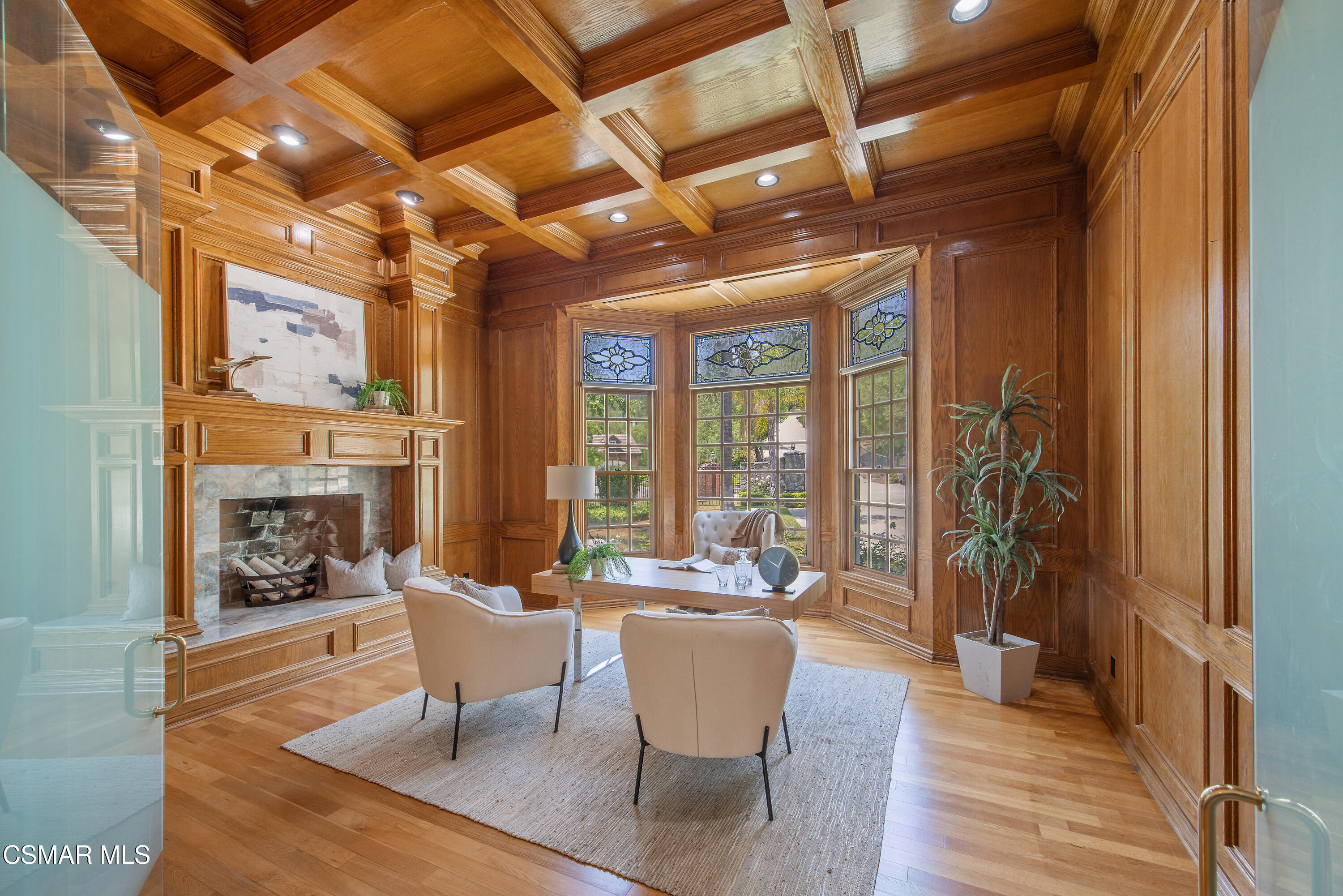 3840 Castle View Road Agoura Hills, CA 91301 - Photo 30 of 94 a dining room with furniture a fireplace and wooden floor