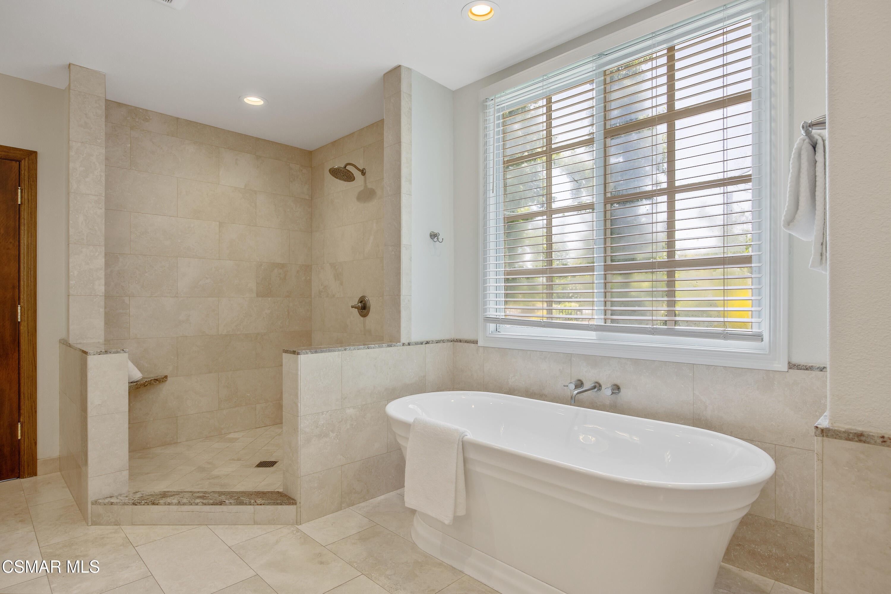 3840 Castle View Road Agoura Hills, CA 91301 - Photo 35 of 94 a white bath tub sitting in a bathroom next to a shower