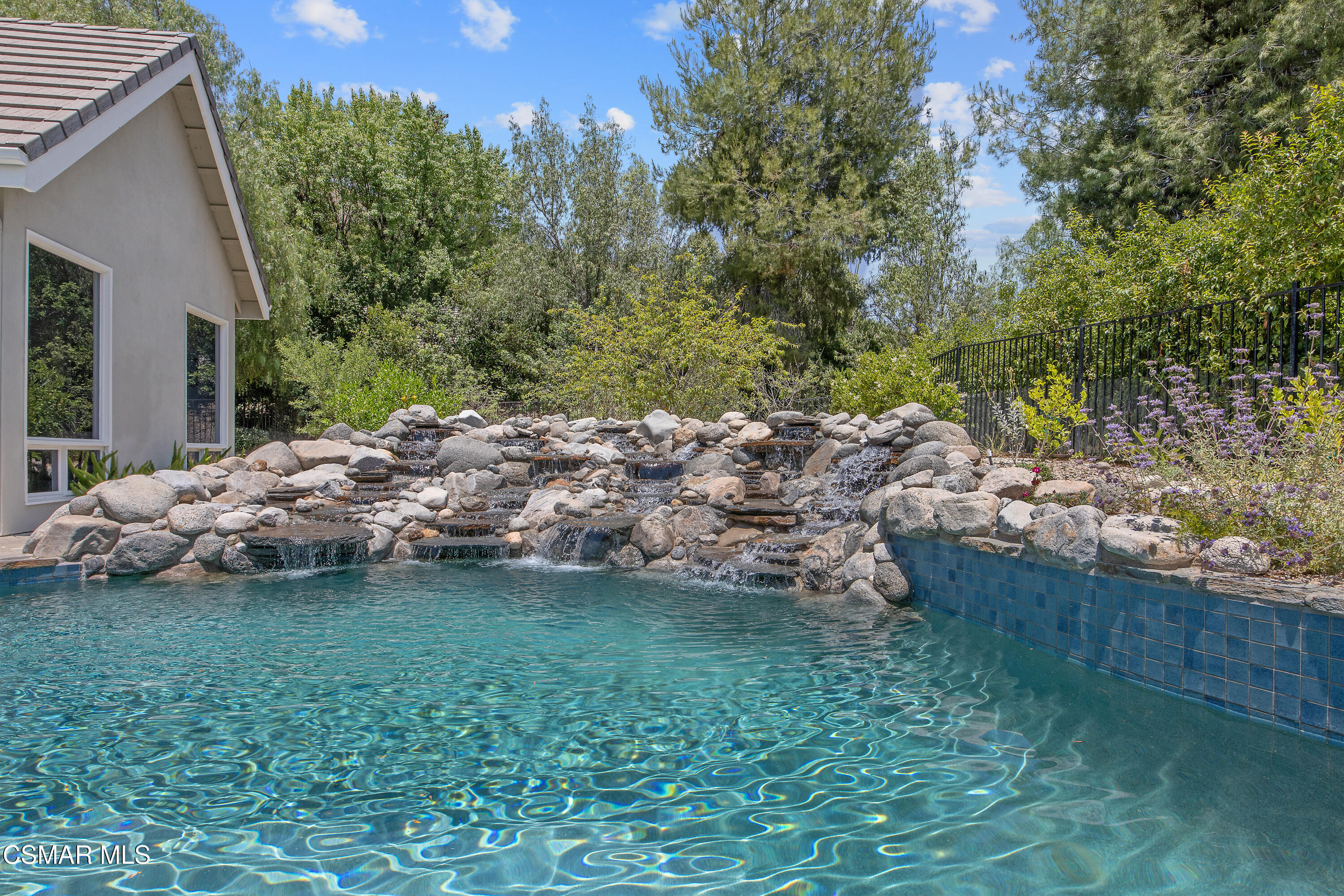 3840 Castle View Road Agoura Hills, CA 91301 - Photo 64 of 94 a view of a wooden house with a yard and large trees