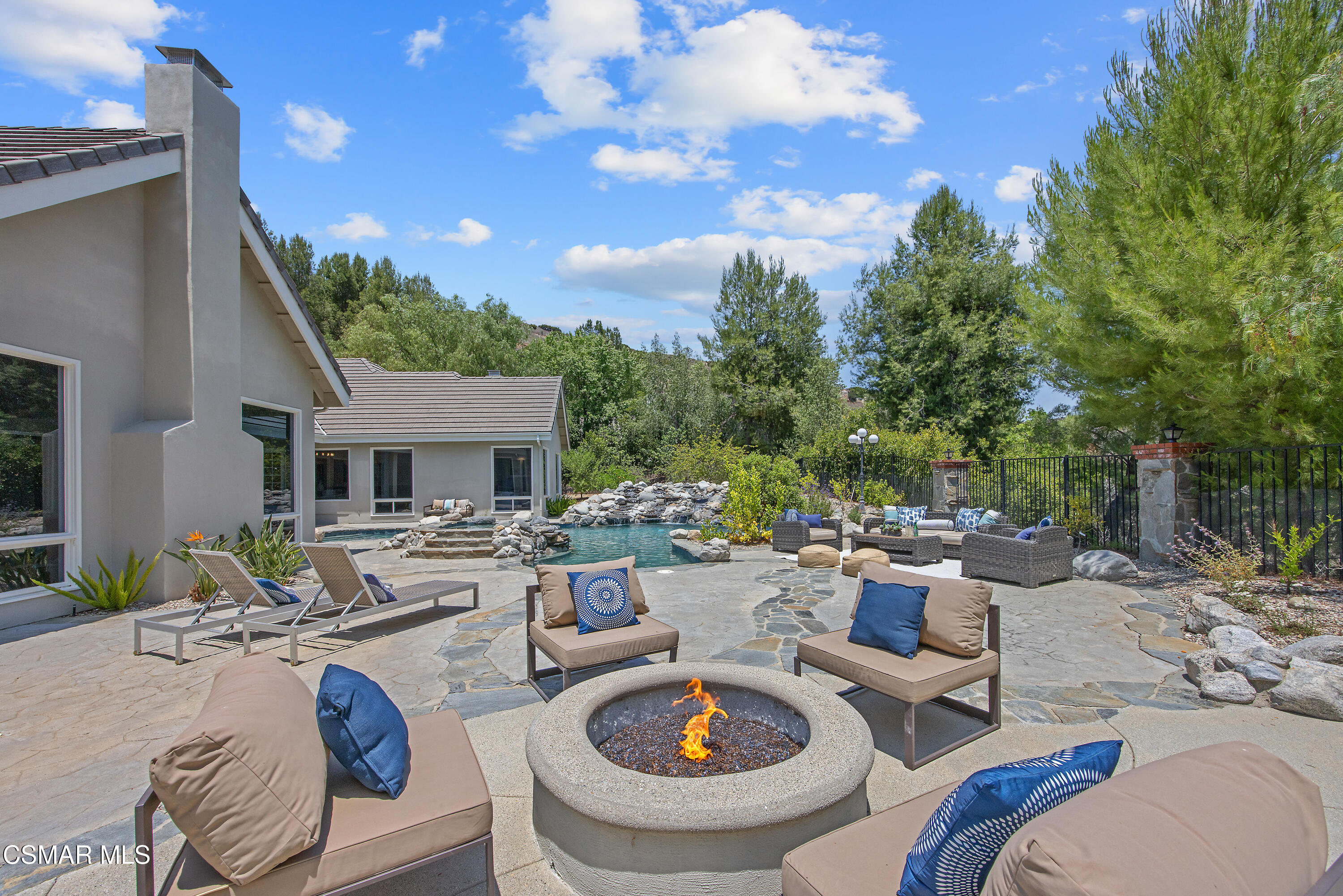 3840 Castle View Road Agoura Hills, CA 91301 - Photo 66 of 94 a view of a patio with couches chairs and a fire pit