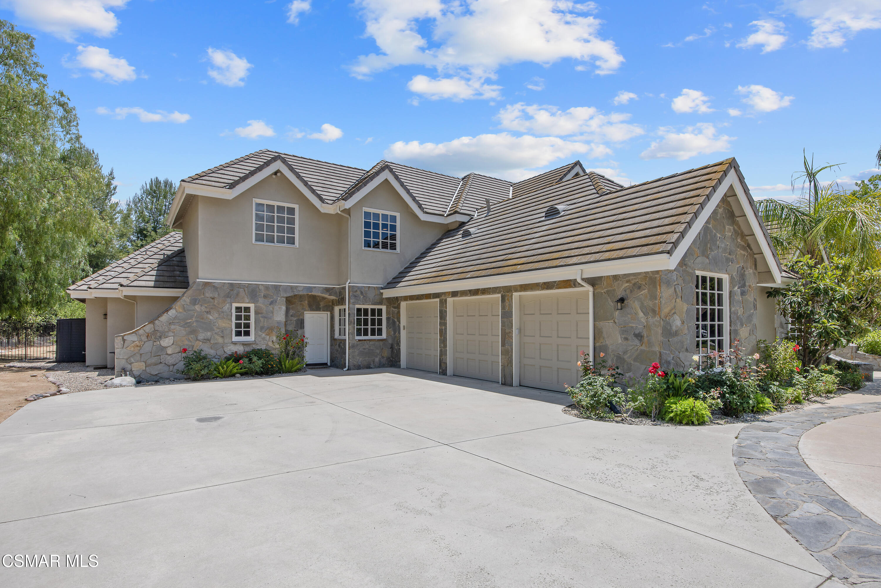 3840 Castle View Road Agoura Hills, CA 91301 - Photo 73 of 94 a front view of a house with a yard and garage