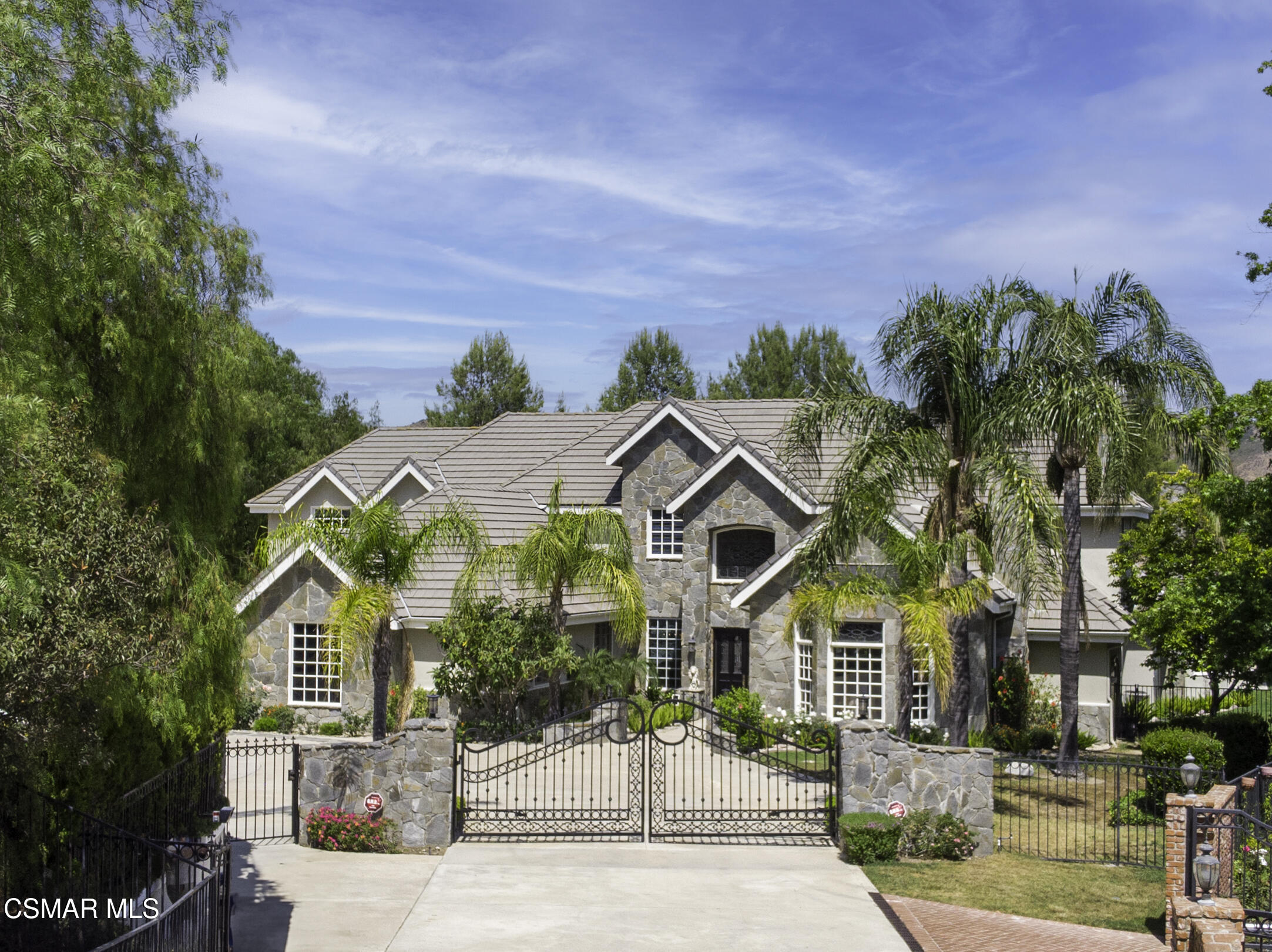 3840 Castle View Road Agoura Hills, CA 91301 - Photo 77 of 94 a front view of a house with a garden