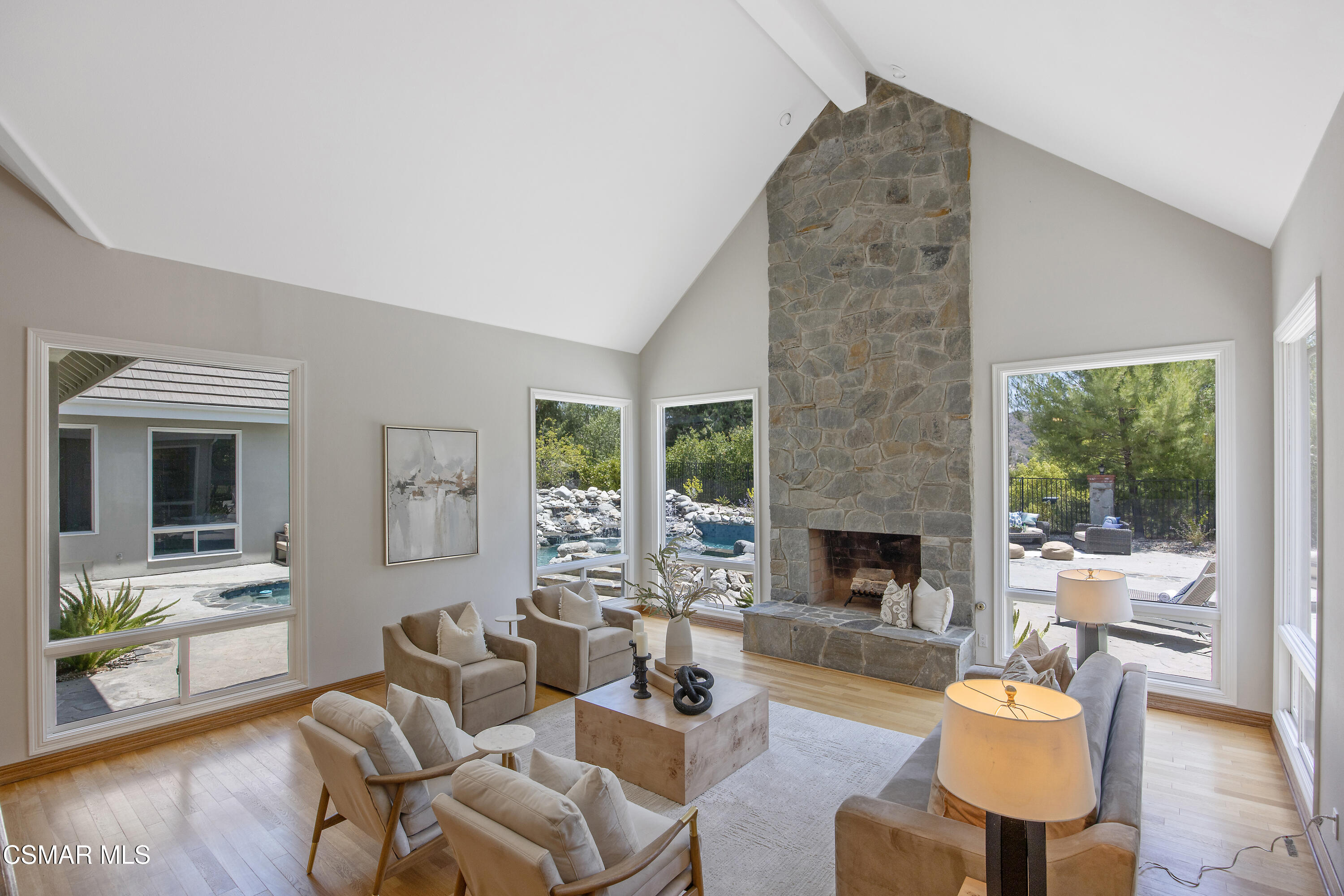3840 Castle View Road Agoura Hills, CA 91301 - Photo 10 of 94 a living room with furniture and a fireplace