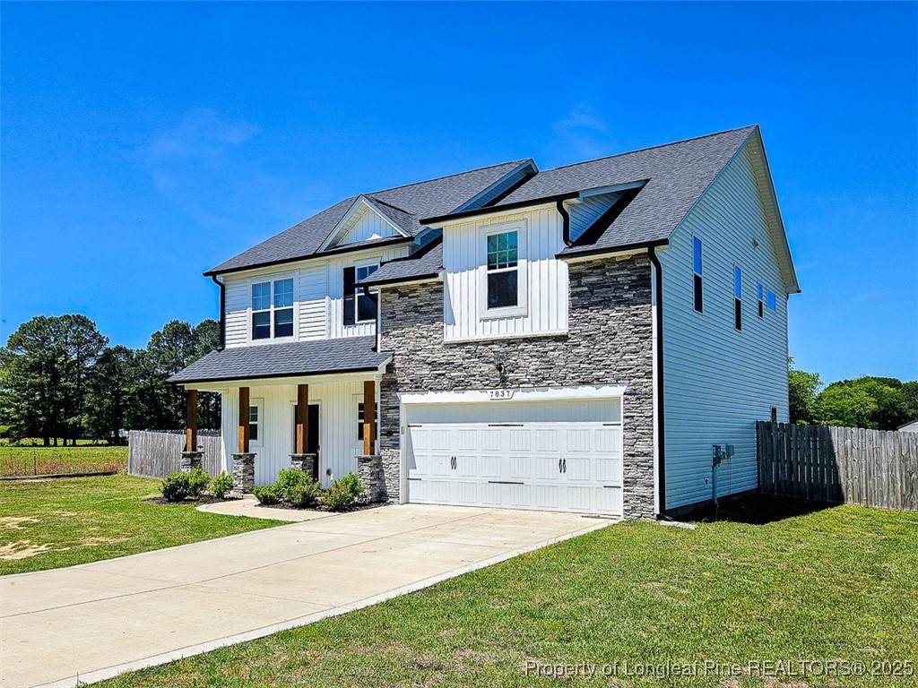 7837 Maxwell Road Stedman, NC 28391 - Photo 2 of 11 a front view of a house with a yard