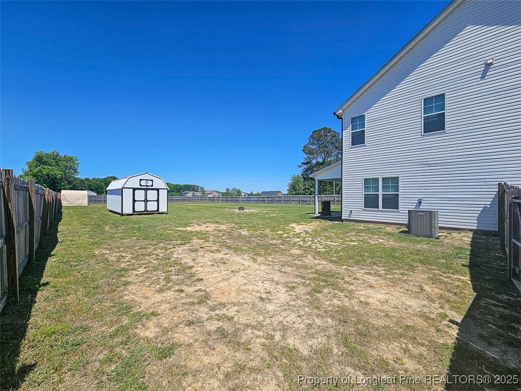 7837 Maxwell Road Stedman, NC 28391 - Photo 4 of 11 a view of a house with backyard and garden