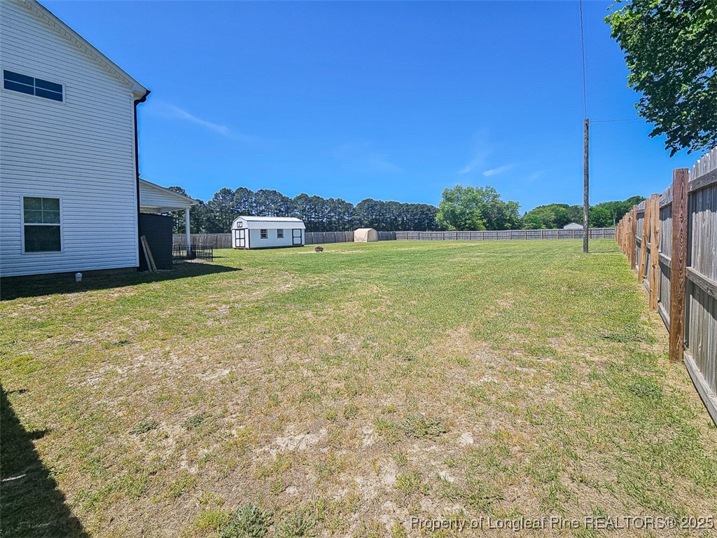 7837 Maxwell Road Stedman, NC 28391 - Photo 5 of 11 a view of a yard with an outdoor space