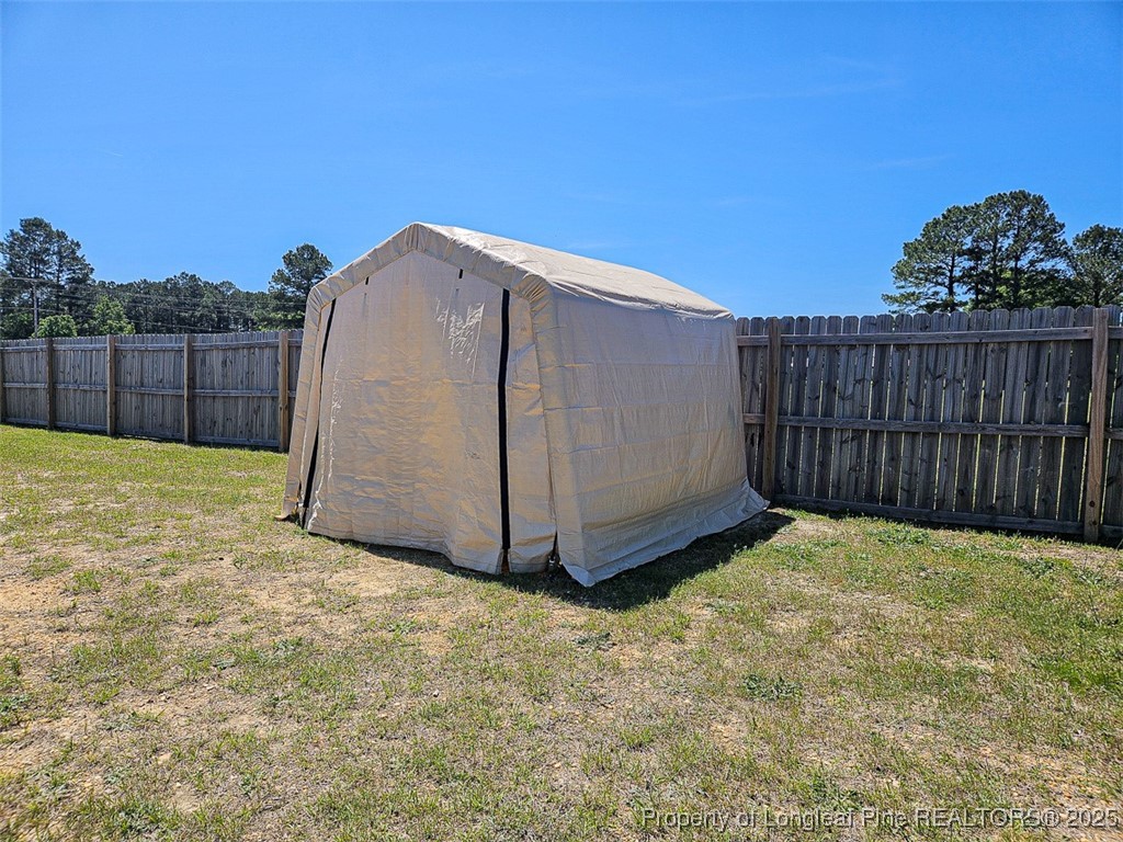 7837 Maxwell Road Stedman, NC 28391 - Photo 10 of 11 a view of a backyard