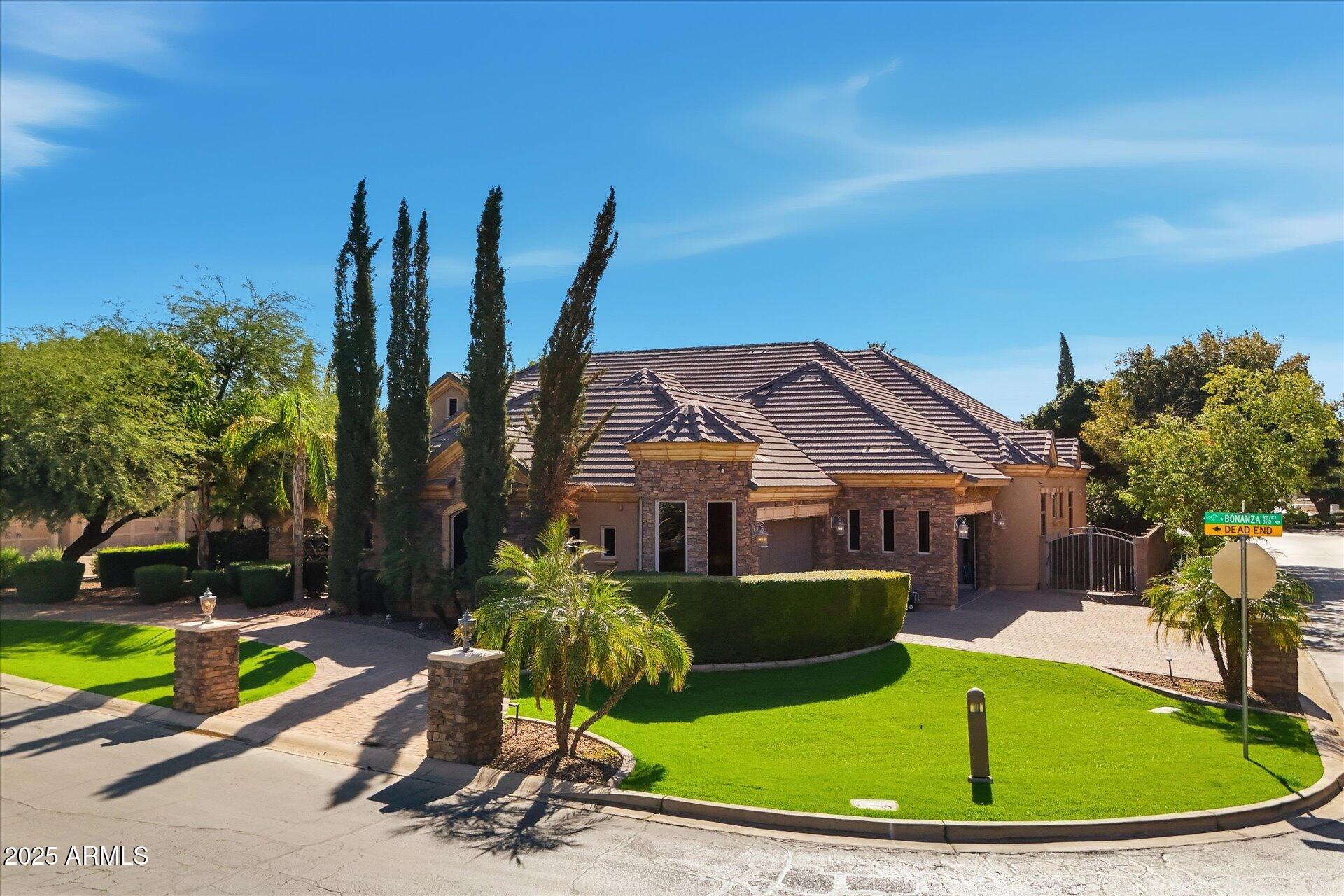 3121 East Bonanza Court Gilbert, AZ 85297 - Photo 1 of 83 a view of a house with a swimming pool and sitting area