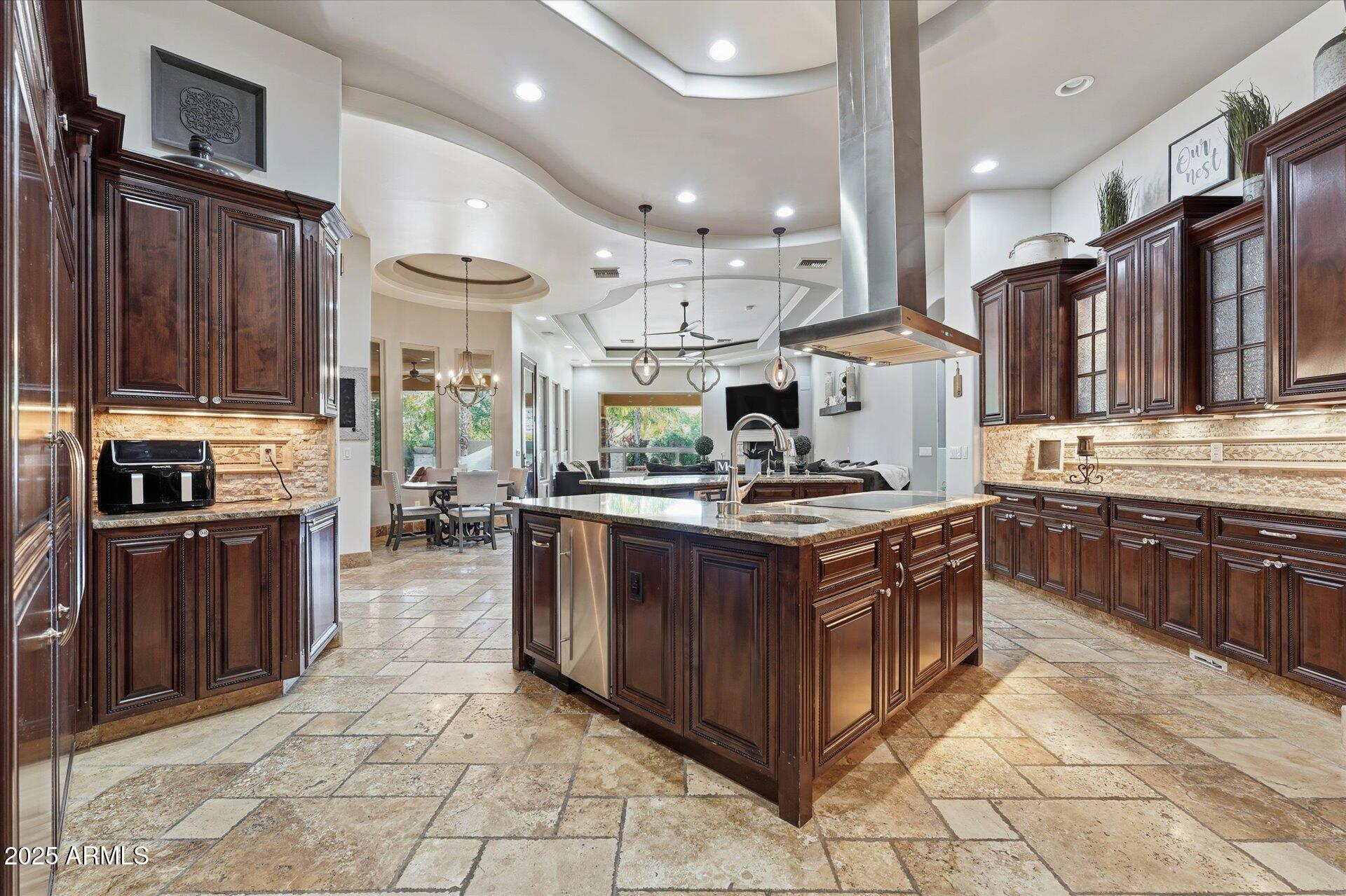 3121 East Bonanza Court Gilbert, AZ 85297 - Photo 19 of 83 a kitchen with stainless steel appliances granite countertop a stove top oven a sink dishwasher and a refrigerator
