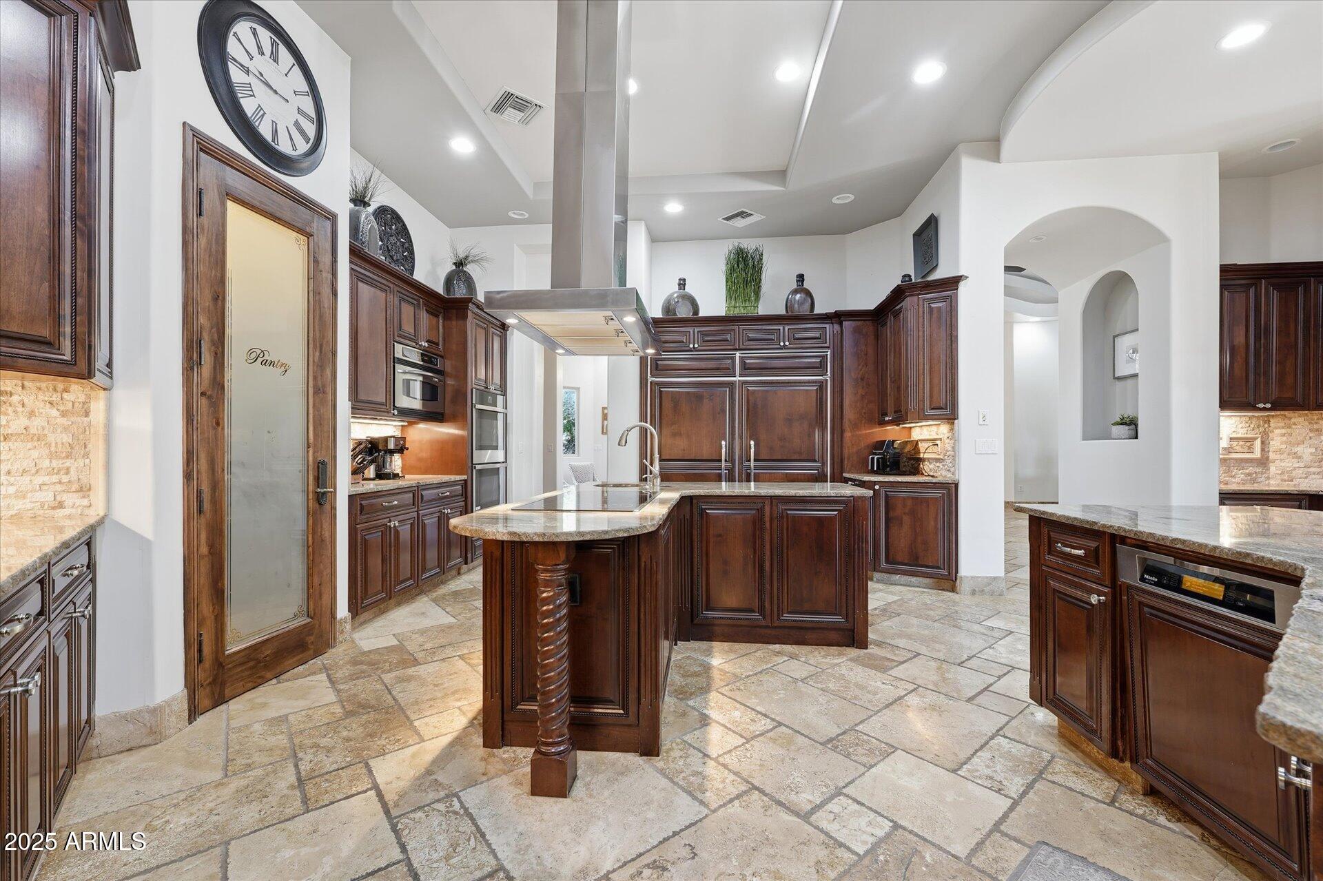 3121 East Bonanza Court Gilbert, AZ 85297 - Photo 20 of 83 a kitchen with stainless steel appliances granite countertop a sink a stove and a refrigerator