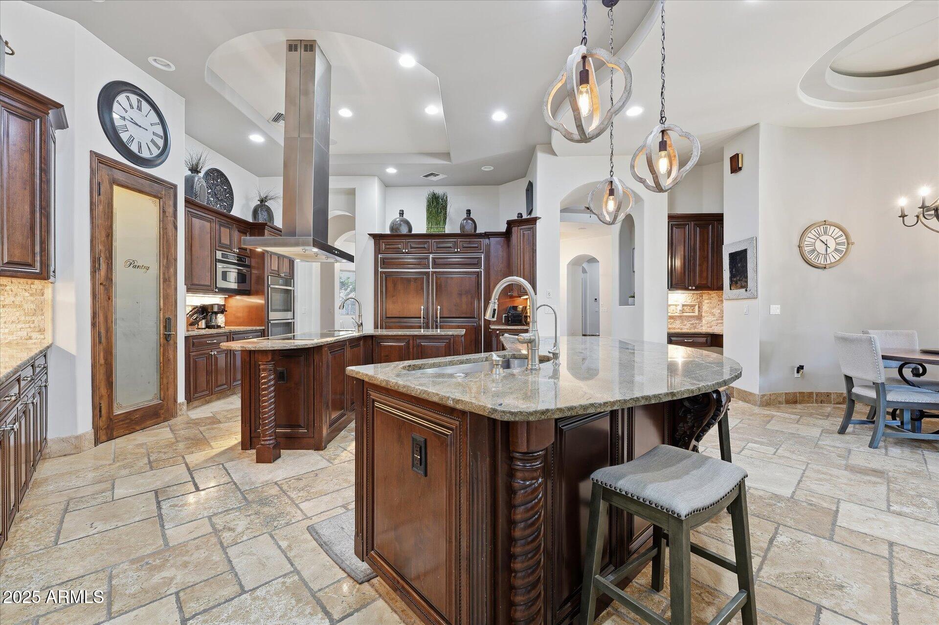 3121 East Bonanza Court Gilbert, AZ 85297 - Photo 21 of 83 a kitchen with a table and chairs in it