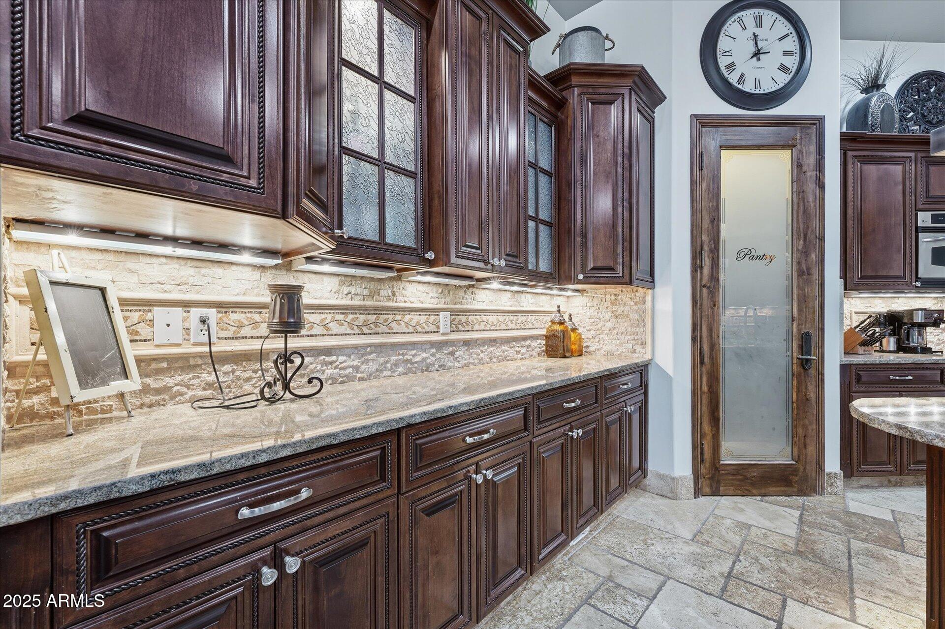 3121 East Bonanza Court Gilbert, AZ 85297 - Photo 22 of 83 a view of a kitchen with stainless steel appliances granite countertop a stove and a refrigerator