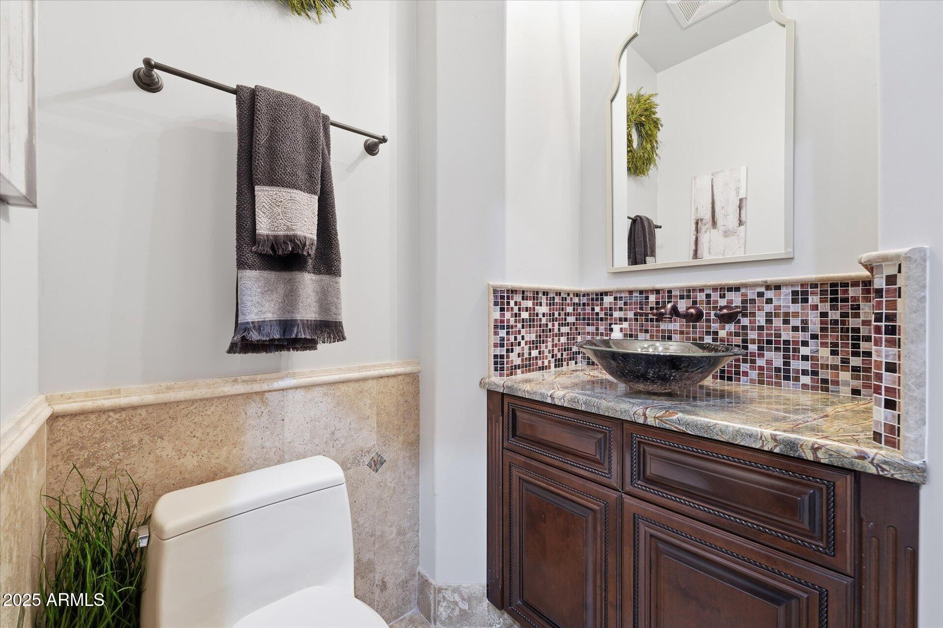 3121 East Bonanza Court Gilbert, AZ 85297 - Photo 36 of 83 a bathroom with a sink and a mirror