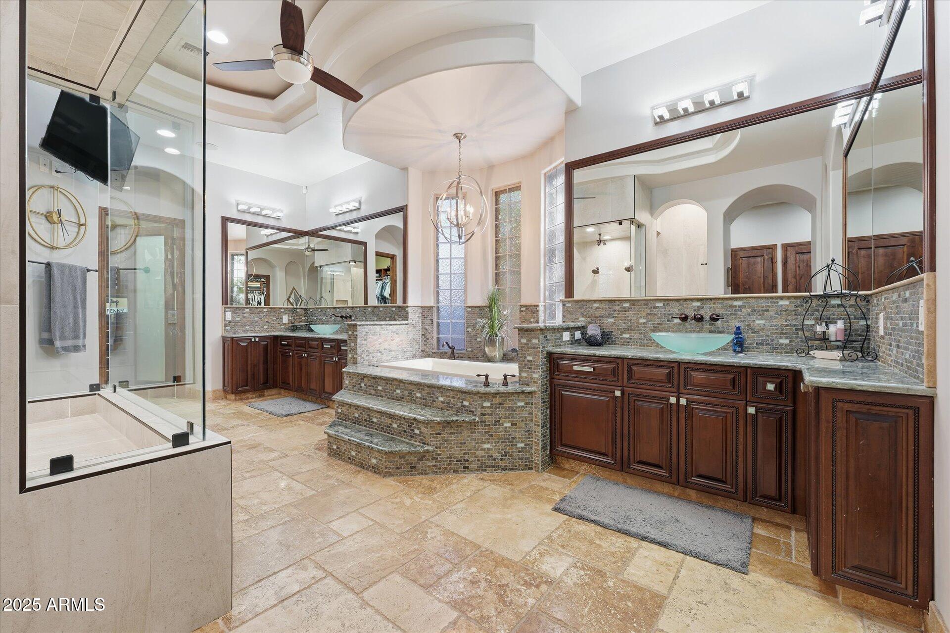 3121 East Bonanza Court Gilbert, AZ 85297 - Photo 42 of 83 a spacious bathroom with a granite countertop sink mirror and bathtub