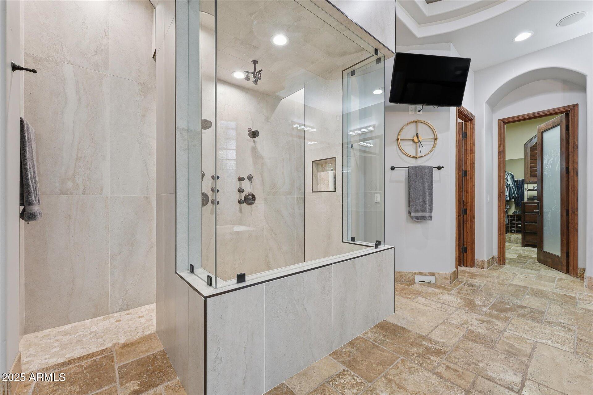 3121 East Bonanza Court Gilbert, AZ 85297 - Photo 43 of 83 a view of a bathroom with a shower and mirror