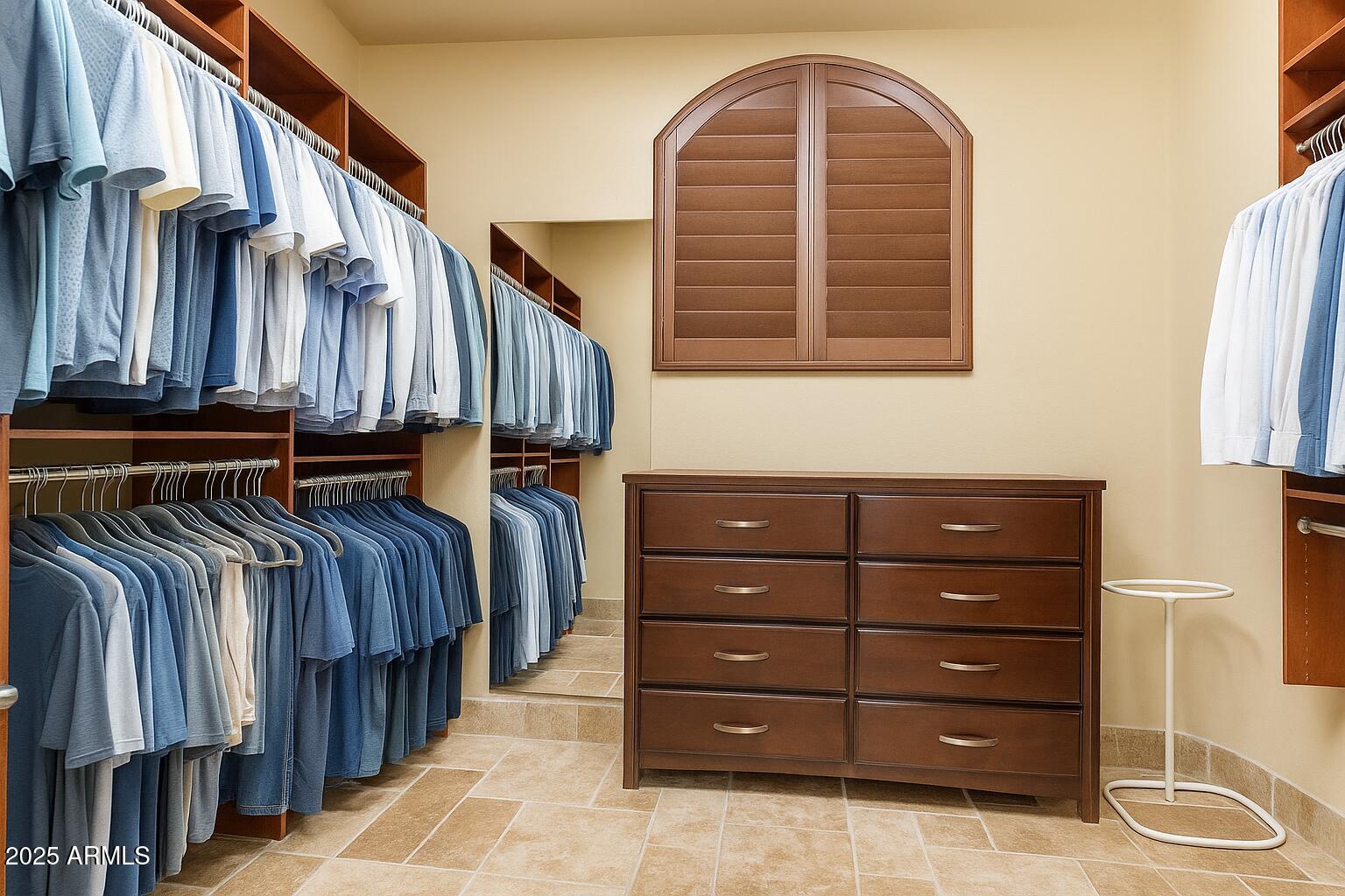 3121 East Bonanza Court Gilbert, AZ 85297 - Photo 46 of 83 a view of walk in closet and wardrobe