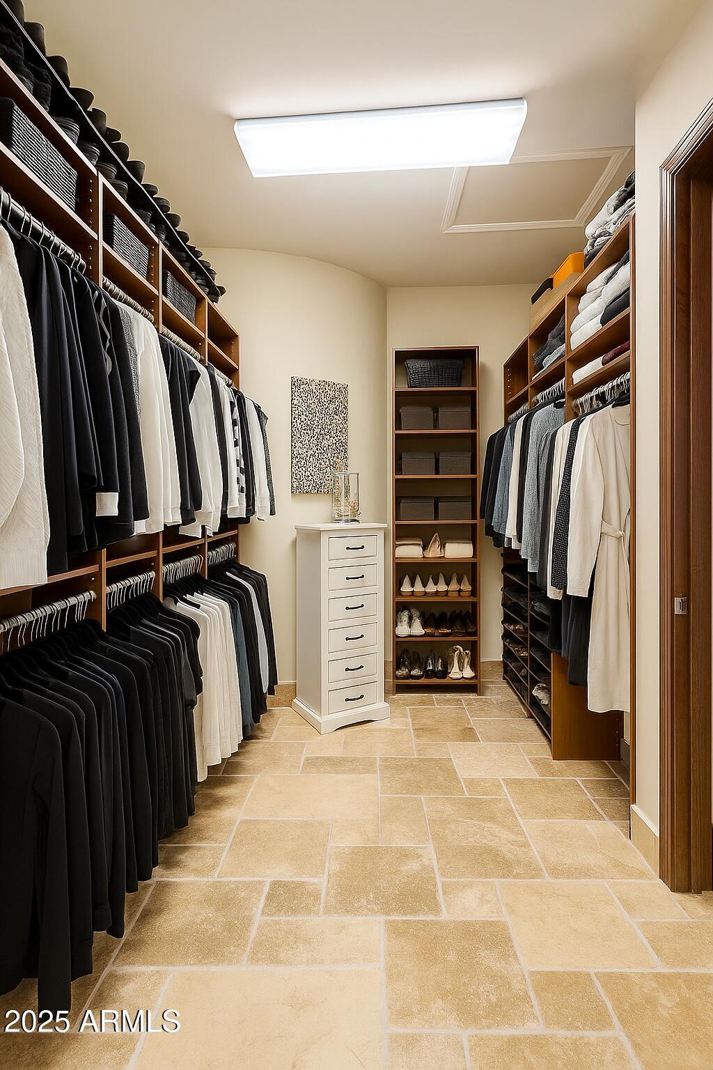 3121 East Bonanza Court Gilbert, AZ 85297 - Photo 47 of 83 a view of walk in closet with clothes and shoes