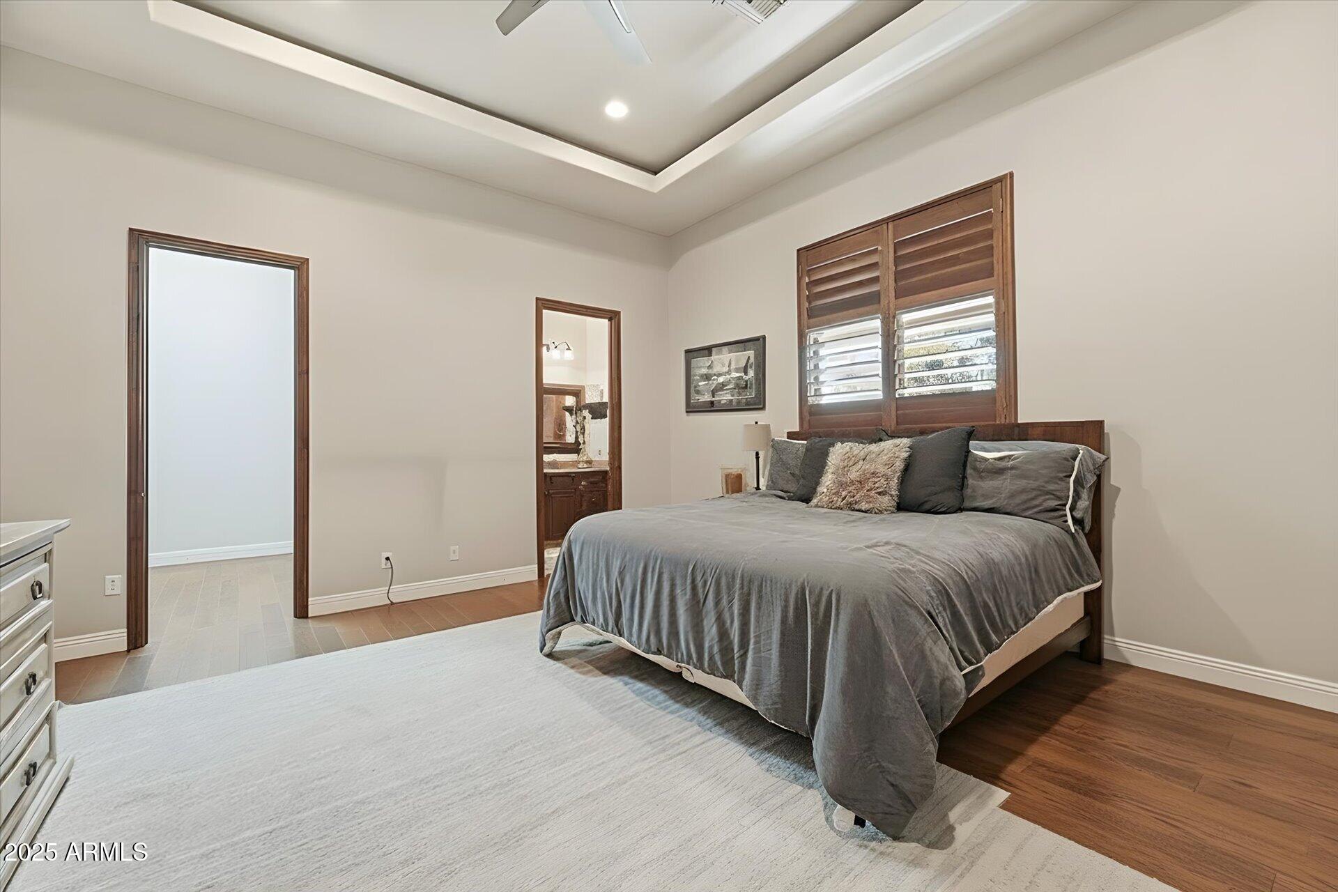 3121 East Bonanza Court Gilbert, AZ 85297 - Photo 49 of 83 a spacious bedroom with a bed and a window
