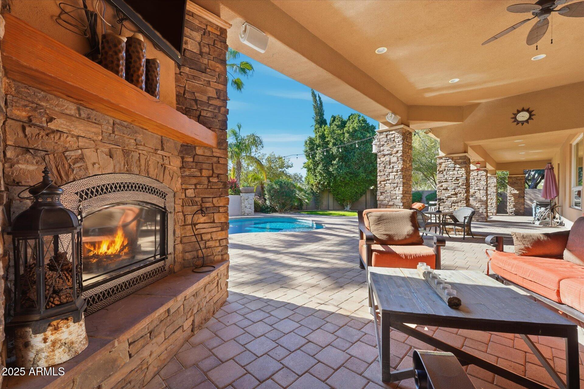 3121 East Bonanza Court Gilbert, AZ 85297 - Photo 66 of 83 a outdoor space with patio the couches and a fireplace