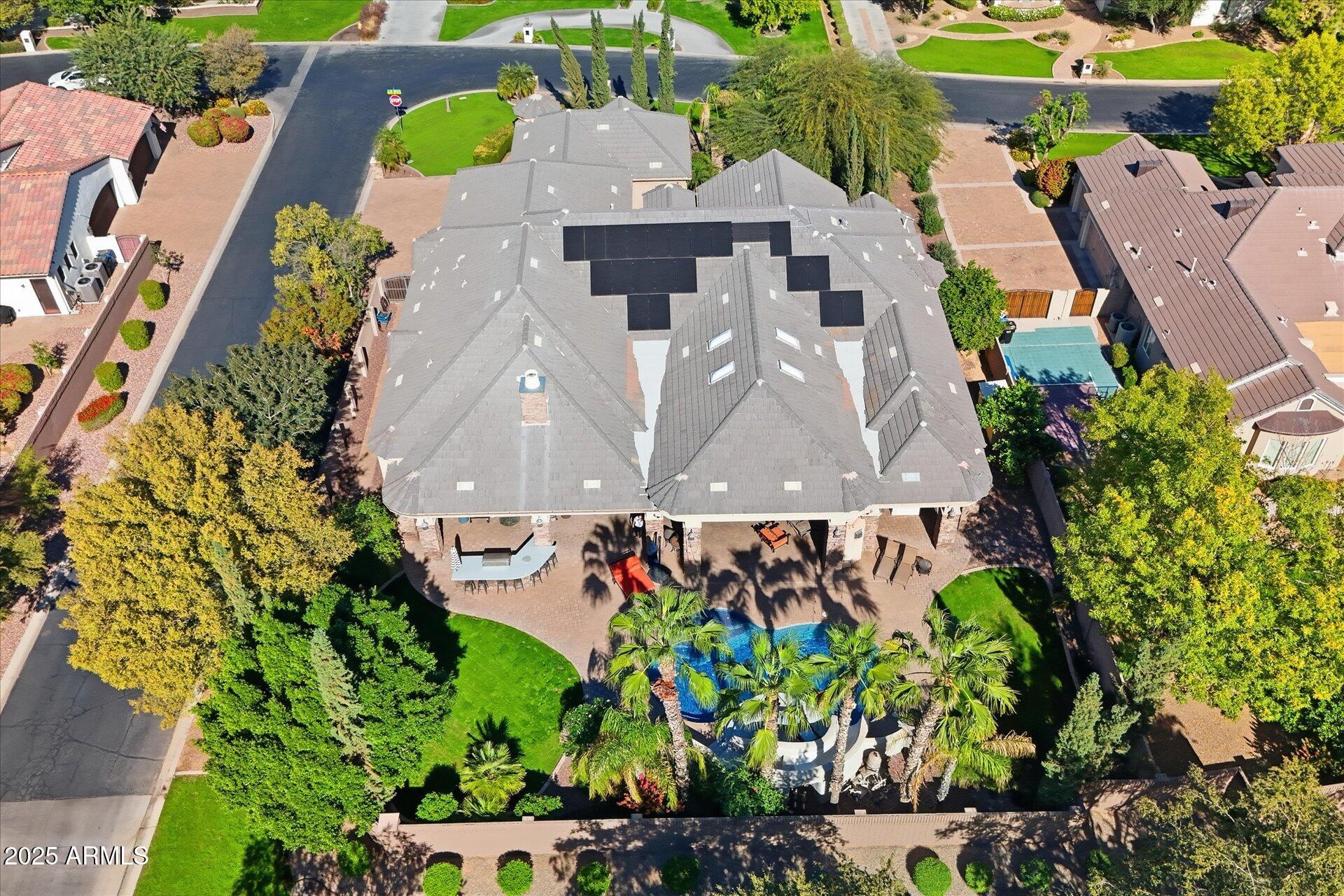 3121 East Bonanza Court Gilbert, AZ 85297 - Photo 77 of 83 an aerial view of a house with a yard and garden