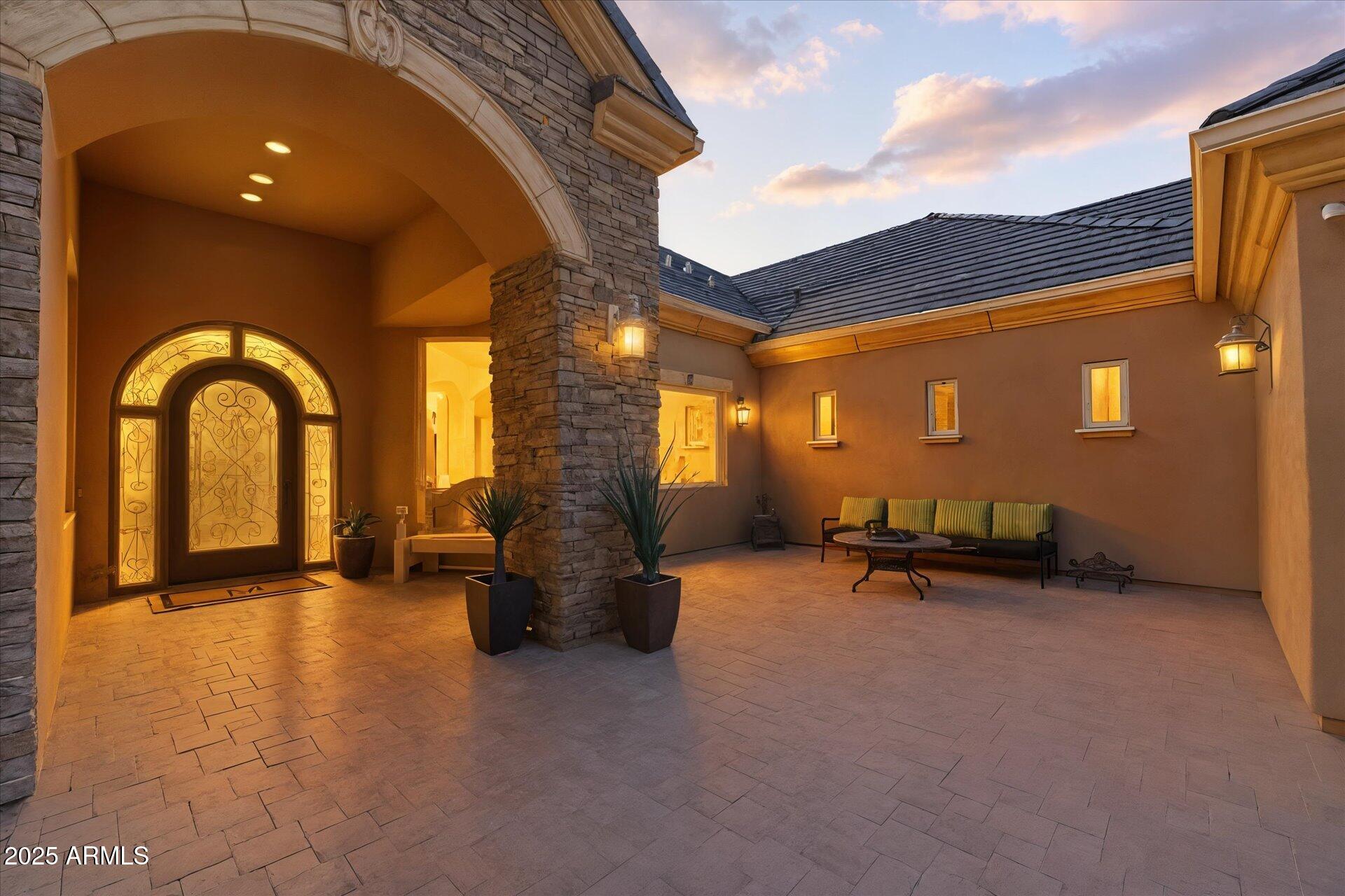3121 East Bonanza Court Gilbert, AZ 85297 - Photo 9 of 83 a view of a terrace with a chair and floor to ceiling window