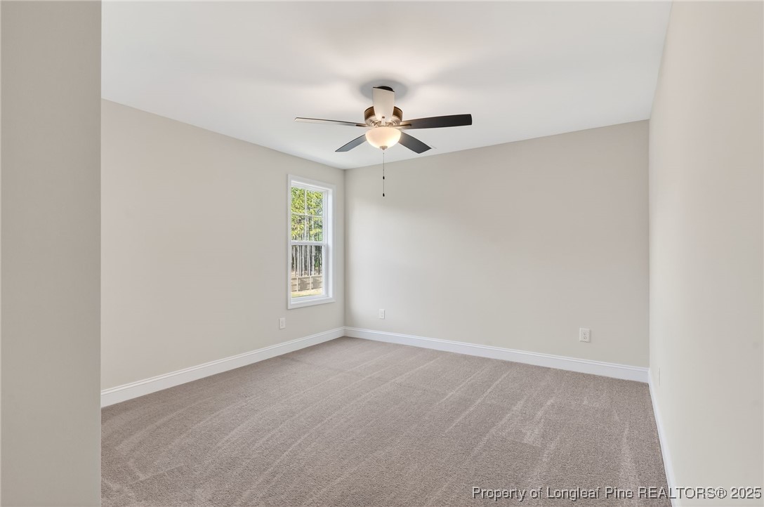 2154 Montrose (lot 6) Road Raeford, NC 28376 - Photo 22 of 44 an empty room with windows and fan