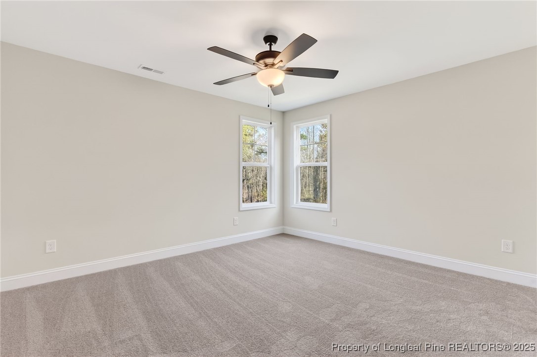 2154 Montrose (lot 6) Road Raeford, NC 28376 - Photo 25 of 44 an empty room with window and ceiling fan
