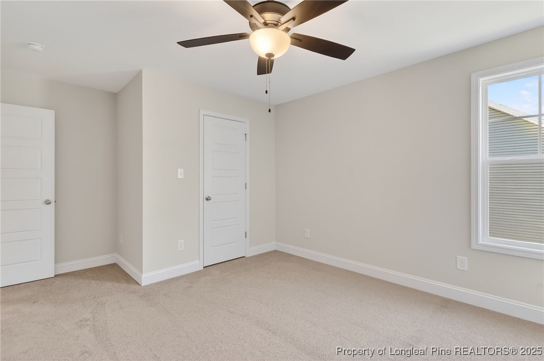 2154 Montrose (lot 6) Road Raeford, NC 28376 - Photo 27 of 44 an empty room with a window and a fan