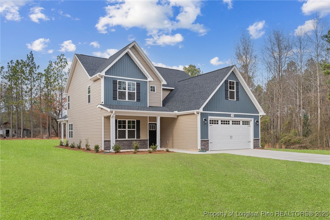 2154 Montrose (lot 6) Road Raeford, NC 28376 - Photo 3 of 44 a front view of a house with a yard