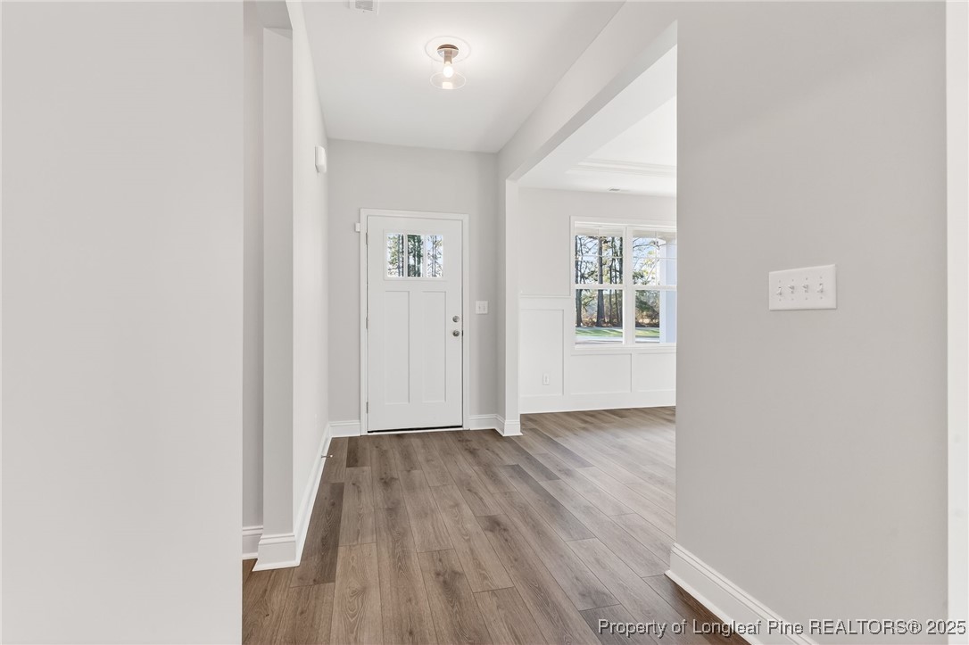 2154 Montrose (lot 6) Road Raeford, NC 28376 - Photo 32 of 44 an empty room with wooden floor and windows