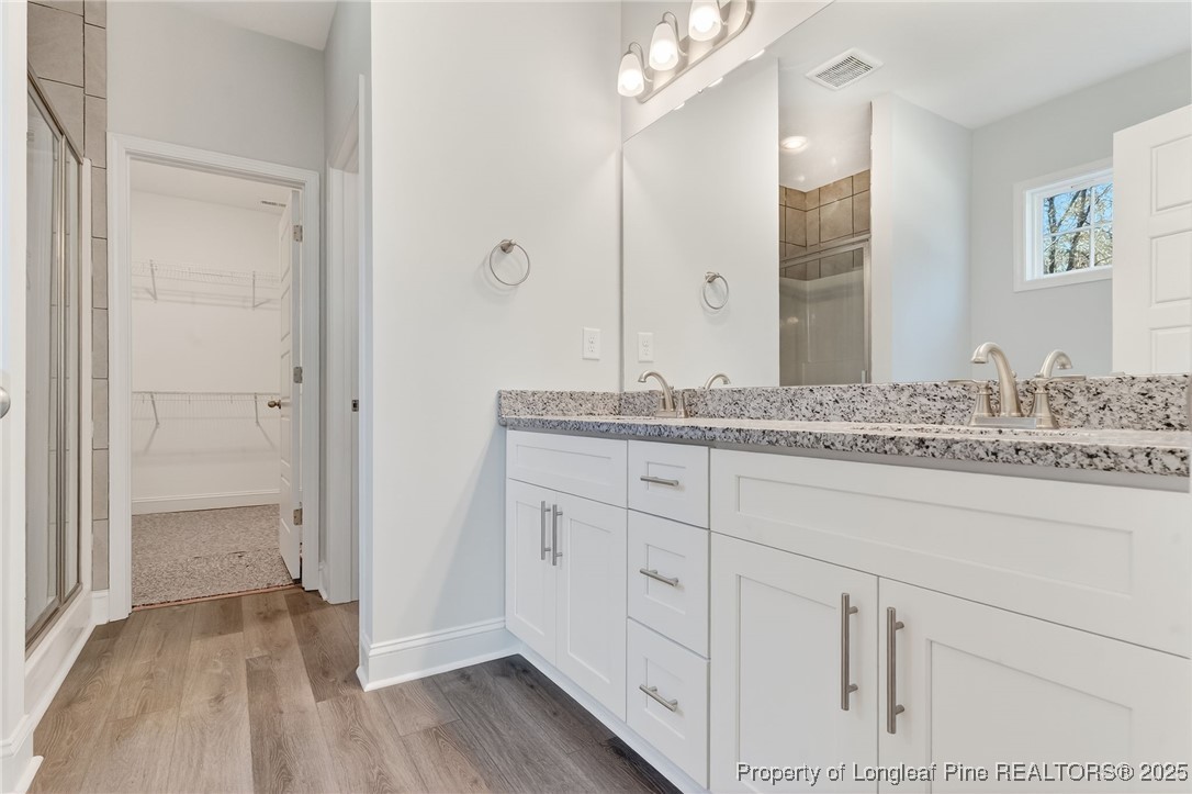 2154 Montrose (lot 6) Road Raeford, NC 28376 - Photo 37 of 44 a bathroom with a sink and a mirror