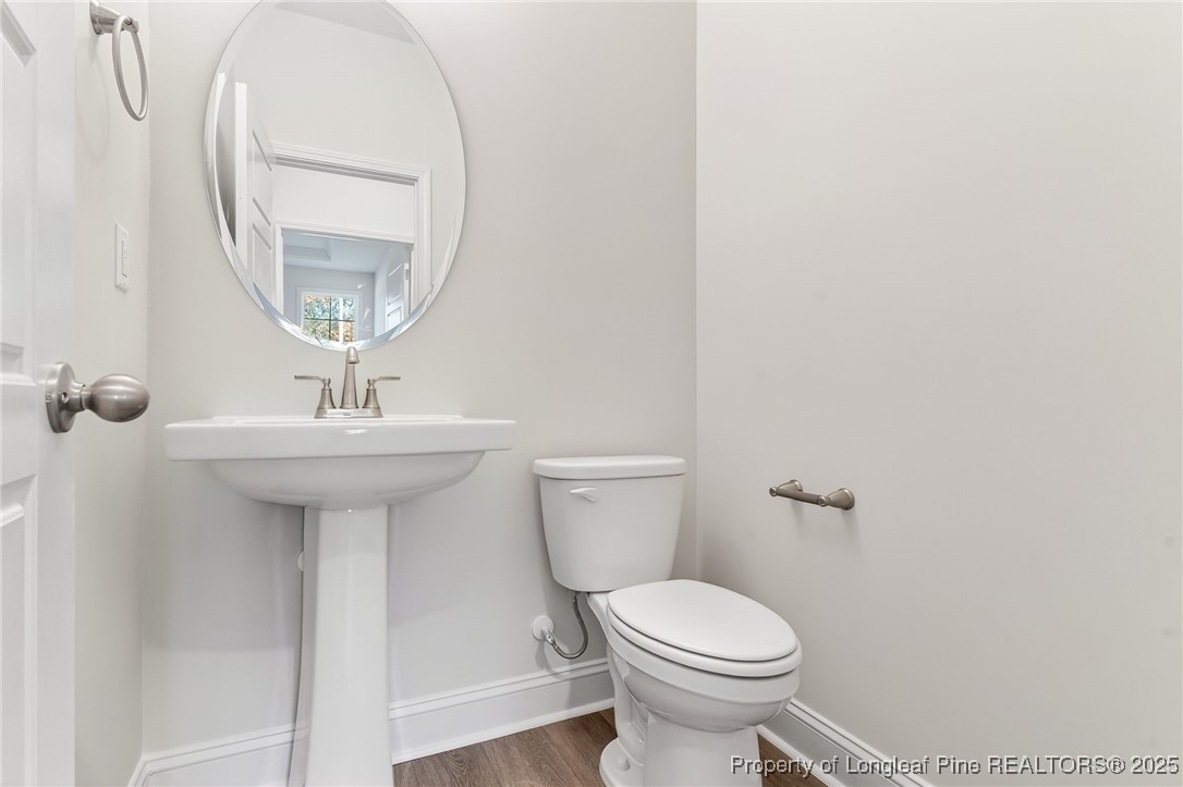 2154 Montrose (lot 6) Road Raeford, NC 28376 - Photo 38 of 44 a bathroom with a sink toilet and a mirror